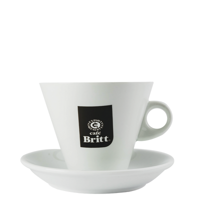 White coffee cup and saucer with a Cafe Britt logo on a white background