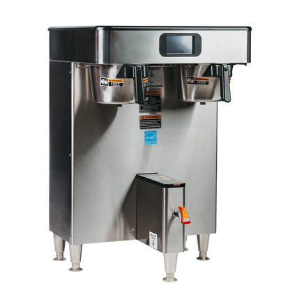 Stainless steel commercial coffee machine on a white background