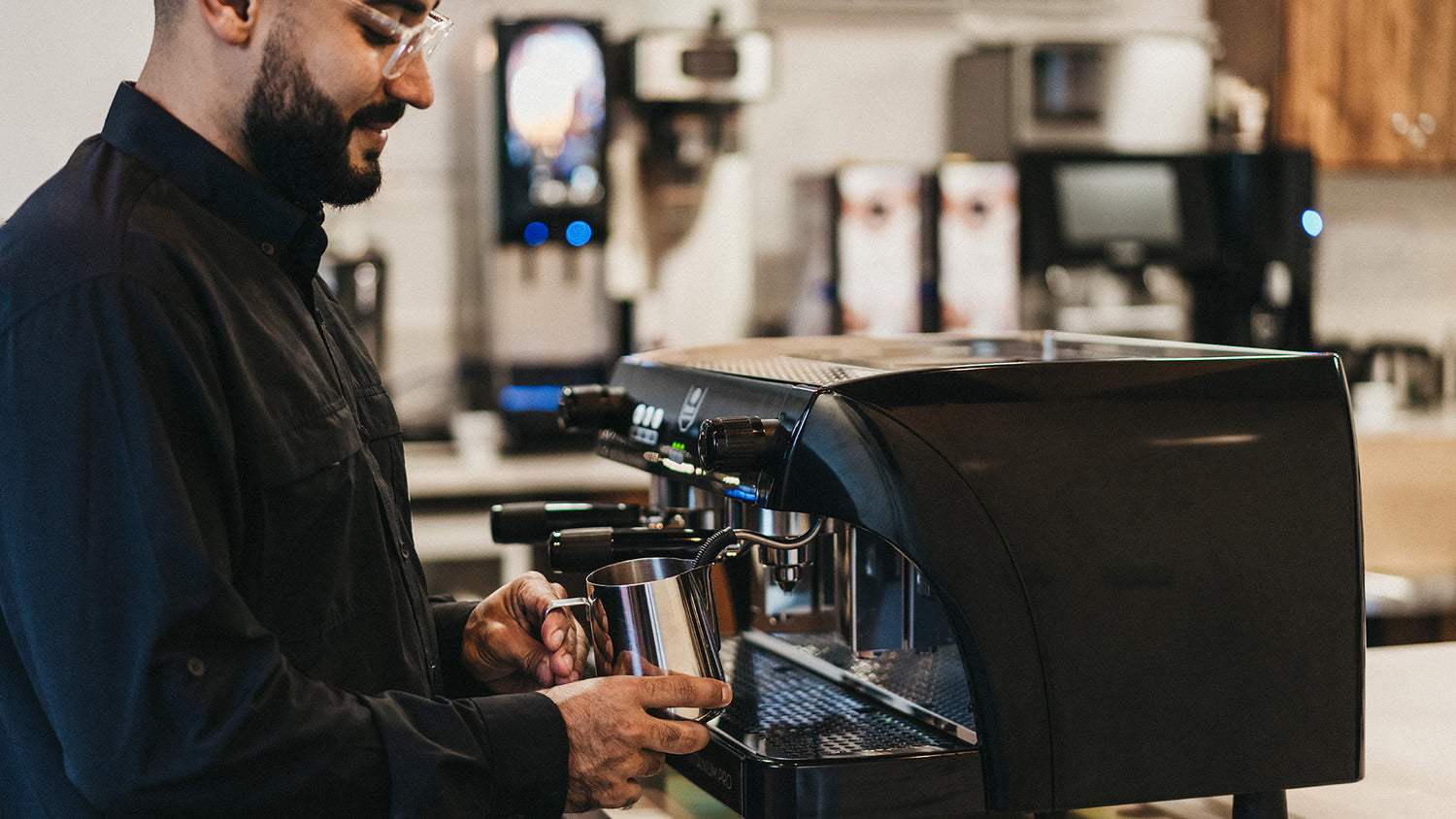 Barista Making foaming up milk.