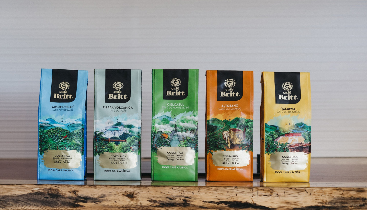 Five coffee bags from the brand 'Britt' on a wooden surface with a neutral background