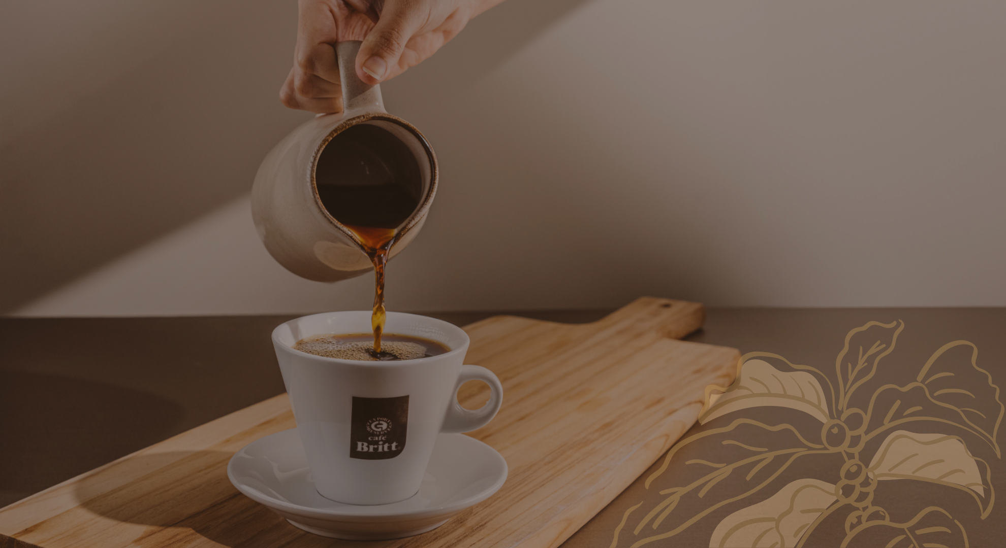 Freshly brewed Café Britt Costa Rican gourmet coffee being poured into a coffee cup