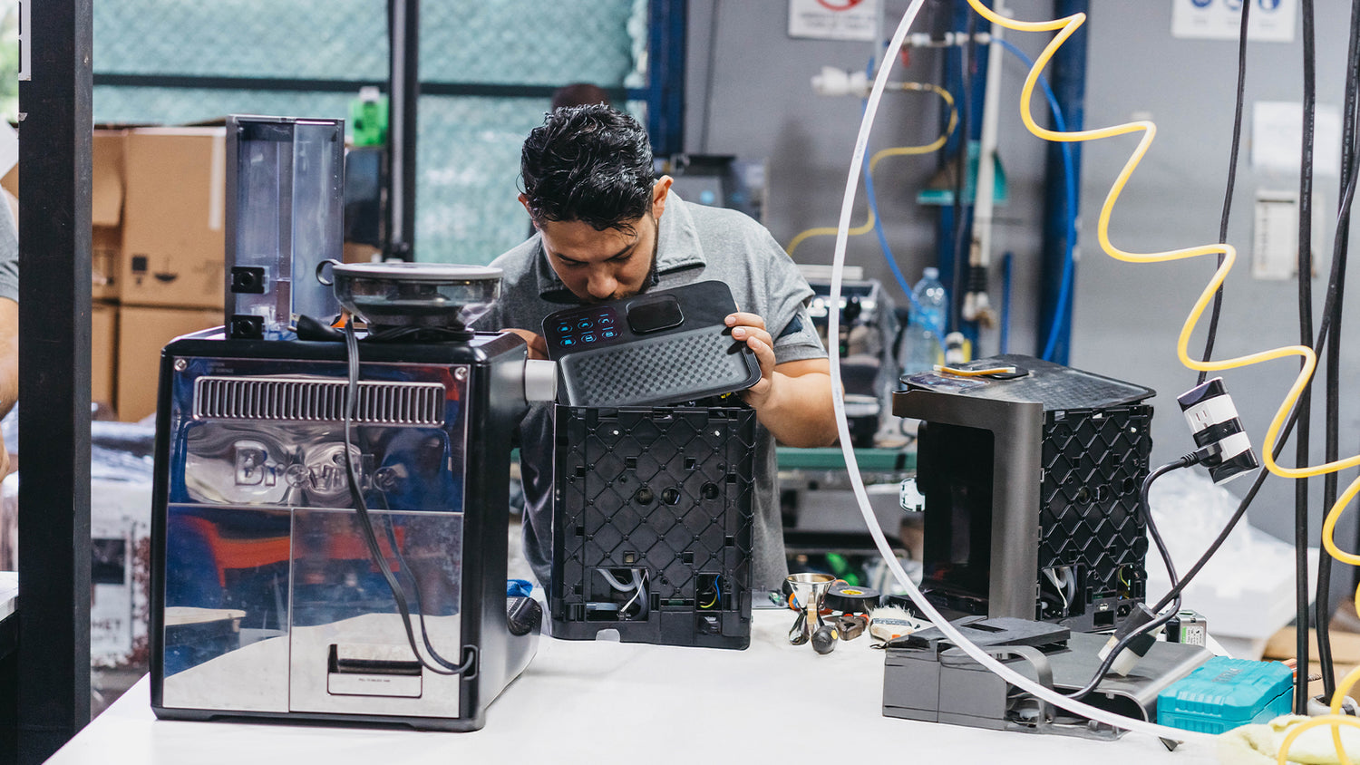 Technical team revising a coffee machine