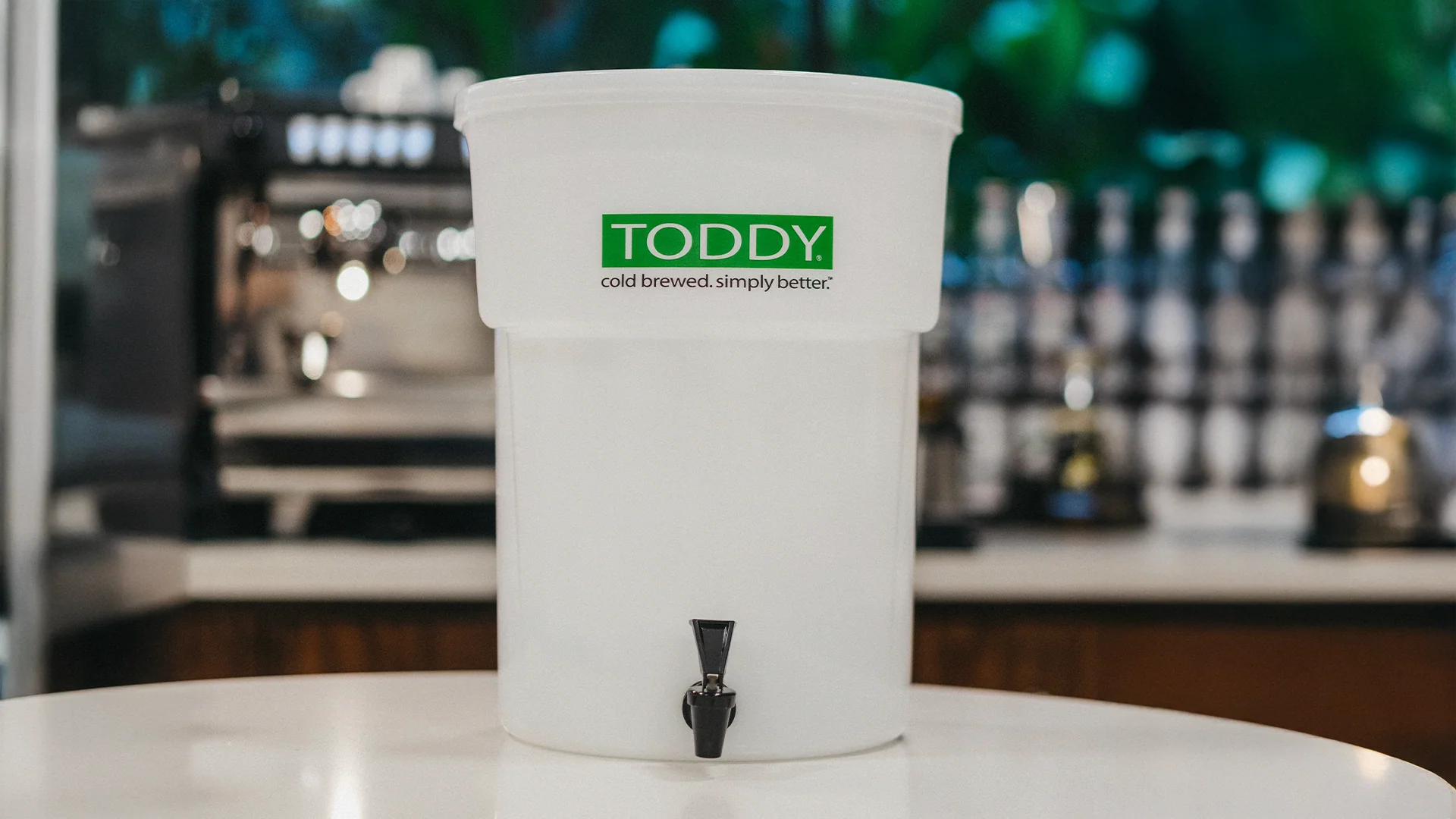 White Toddy with a green label on a bar counter