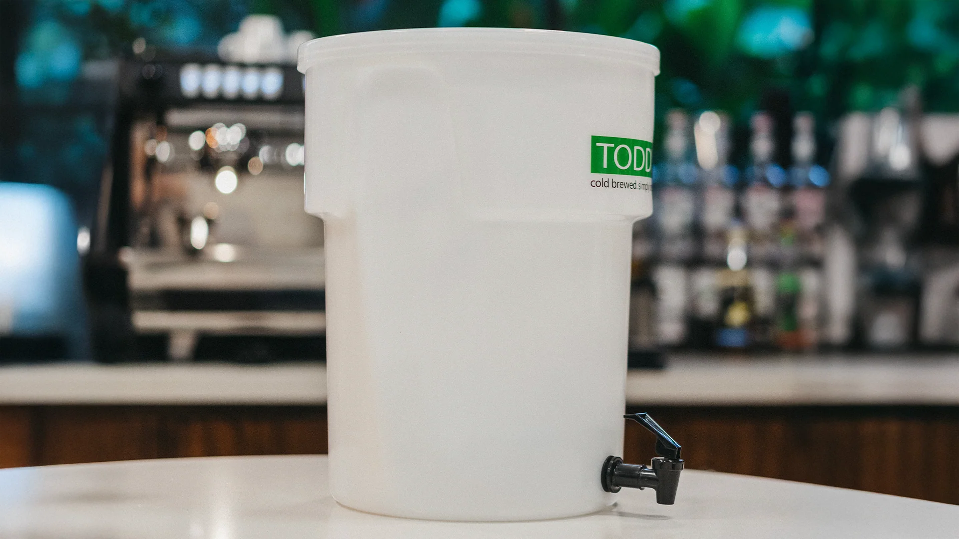 White Toddy with a green label on a bar counter